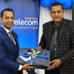 CEO Veemal Gungadin presenting laptop to Le Morne Government School&rsquo;s headmaster