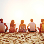 Group of five friends on beach