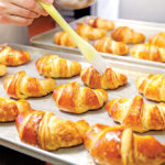 Professional,Bakery.,Detail,Of,Hands,Preparing,French,Croissant,In,Color