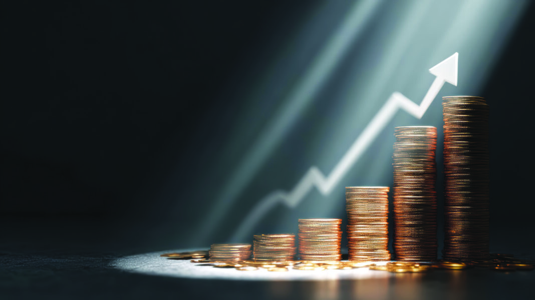financial-growth-concept-with-ascending-coin-stacks-upward-arrow
